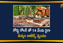 Andhra Pradesh, Andhra Pradesh News, AP Liquor Bottles, AP Liquor Bottles News, Liquor Bottles Worth Rs 72 Lakh Being Destroyed by Road Roller, Police crush seized liquor bottles, Police destroys liquor bottles worth Rs 72 lakh, Seized liquor bottles worth Rs 72 lakh
