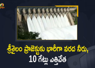 10 gates lifted as Srisailam reservoir, 10 Gates Lifted to Discharge Huge Flood Water, Mango News, Srisailam, srisailam dam, Srisailam Dam 2021, Srisailam Dam Latest News, Srisailam Gates Lifted, Srisailam gates lifted again, Srisailam gates lifted again to discharge huge flood, Srisailam gates lifted in July to discharge flood, Srisailam Project, Srisailam Project 10 Gates Lifted, Srisailam Project: 10 Gates Lifted to Discharge Huge Flood Water