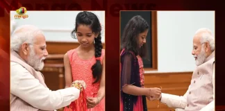 PM Modi Celebrates Raksha Bandhan with Youngsters at his Residence in New Delhi, Prime Minister Narendra Modi Celebrates Raksha Bandhan with Youngsters at his Residence in New Delhi, Narendra Modi celebrates Raksha Bandhan with daughters of PMO staff, Raksha Bandhan with Youngsters, Prime Minister Narendra Modi, PM Modi, Raksha Bandhan, Raksha Bandhan Wishes, Raksha Bandhan Greetings, 2022 Raksha Bandhan, PM Modi News, PM Modi Latest News, PM Modi Latest Updates, PM Modi Live Updates, Mango News, Mango News Telugu,