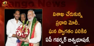PM Modi Reaches Vizag AP Governor Biswabhusan and CM YS Jagan Welcomes in Grand Way, AP Governor Biswabhusan and CM YS Jagan Welcomes in Grand Way, PM Modi Reaches Vizag, AP Governor Biswabhusan, Governor Biswabhusan, AP CM YS Jagan Mohan Reddy, PM Modi in Vizag Public Meeting, AP CM YS Jagan Mohan Reddy, PM Narendra Modi Two-Day Visit, PM Narendra Modi Participates in Huge Road Show at Visakhapatnam, Huge Road Show at Visakhapatnam, PM Modi at Vizag, PM Modi Vizag Tour, PM Modi Vizag Visit, PM Modi in Visakhapatnam, Prime Minister Narendra Modi, Narendra Modi, PM Narendra Modi in Visakhapatnam, PM Modi Vizag Tour News, PM Modi Vizag Tour Latest News And Updates, PM Modi Vizag Tour Live Updates, Mango News, Mango News Telugu