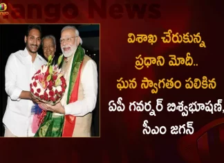 PM Modi Reaches Vizag AP Governor Biswabhusan and CM YS Jagan Welcomes in Grand Way, AP Governor Biswabhusan and CM YS Jagan Welcomes in Grand Way, PM Modi Reaches Vizag, AP Governor Biswabhusan, Governor Biswabhusan, AP CM YS Jagan Mohan Reddy, PM Modi in Vizag Public Meeting, AP CM YS Jagan Mohan Reddy, PM Narendra Modi Two-Day Visit, PM Narendra Modi Participates in Huge Road Show at Visakhapatnam, Huge Road Show at Visakhapatnam, PM Modi at Vizag, PM Modi Vizag Tour, PM Modi Vizag Visit, PM Modi in Visakhapatnam, Prime Minister Narendra Modi, Narendra Modi, PM Narendra Modi in Visakhapatnam, PM Modi Vizag Tour News, PM Modi Vizag Tour Latest News And Updates, PM Modi Vizag Tour Live Updates, Mango News, Mango News Telugu