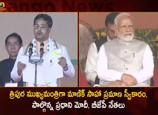 త్రిపుర ముఖ్యమంత్రిగా మాణిక్ సాహా ప్రమాణ స్వీకారం, పాల్గొన్న ప్రధాని మోదీ, బీజేపీ నేతలు Manik Saha Takes Oath as Tripura CM for the 2nd Time Today, PM Modi, JP Nadda, Amit Shah Attends,Manik Saha Takes Oath,Manik Saha Tripura CM,Manik Saha 2nd TimeTripura CM, PM Modi Attends Cermony, JP Nadda Attends Cermony, Amit Shah Attends Cermony,Mango News,Mango News Telugu,Manik Saha,PM Modi,JP Nadda,Amit Shah,Tripura CM Manik Saha,Tripura CM Manik Saha Latest News and Updates,Tripura CM Manik Saha News and Live Updates