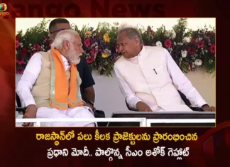 PM Modi Shares Stage with CM Ashok Gehlot While Launches Multi-Crore Projects in Rajasthan Today,PM Modi Shares Stage with CM Ashok Gehlot,PM Modi Launches Multi-Crore Projects in Rajasthan,Multi-Crore Projects in Rajasthan,Mango News,Mango News Telugu,PM Launches Multi-crore Projects in Rajasthan,PM Resuces CM Gehlot When he is unable to Speak,PM Modi Launches Multi-Crore Projects,PM Modi In Rajasthan Today,PM Modi Latest News And Updates,Rajasthan Latest News And Updates,AM Ashok Gehlot,CM Ashok Gehlot Latest News And Updates